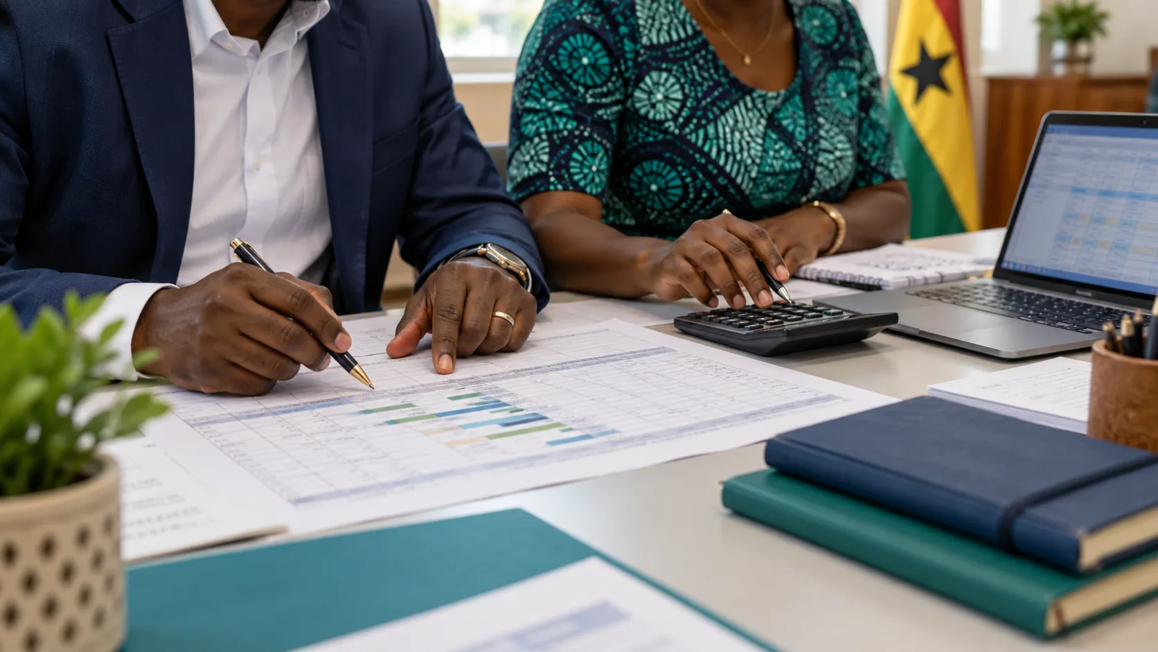 Illustrative close view of planners itemizing activity costs at a desk